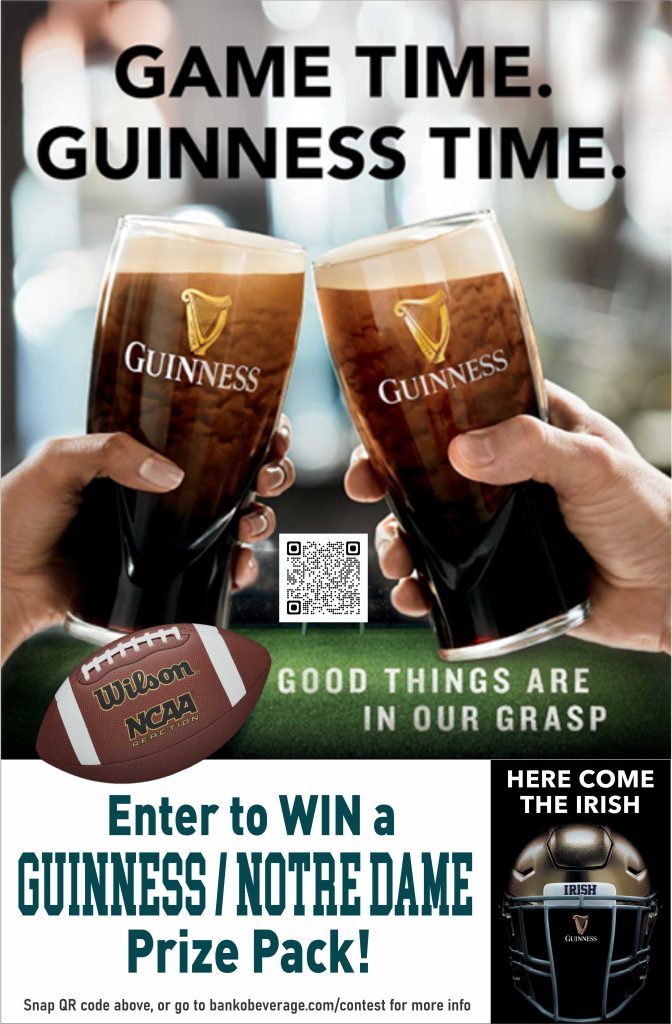 Two full beer glasses with Guinness logos being toasted-- enter to win Guiness Party Pack
